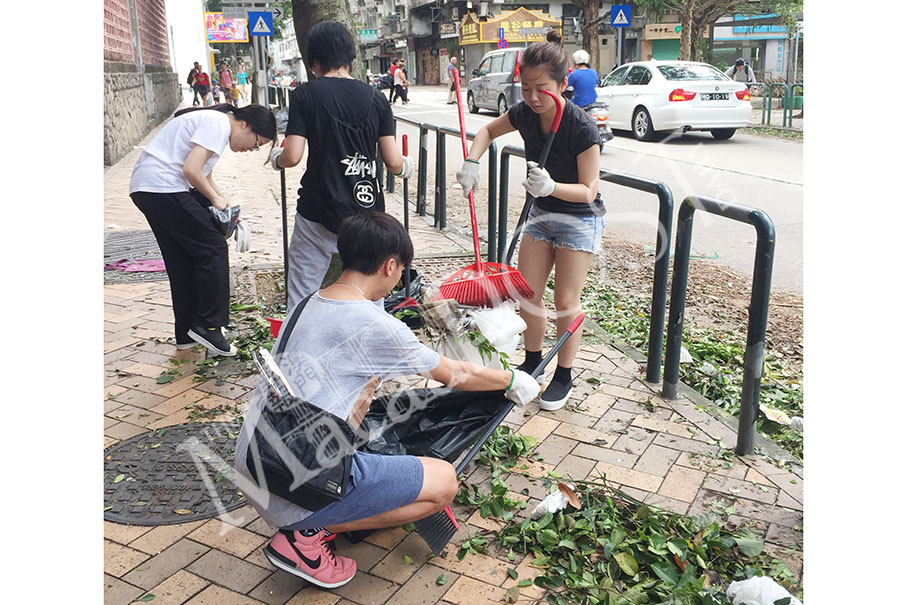 Volunteers help clean up streets after Hato 