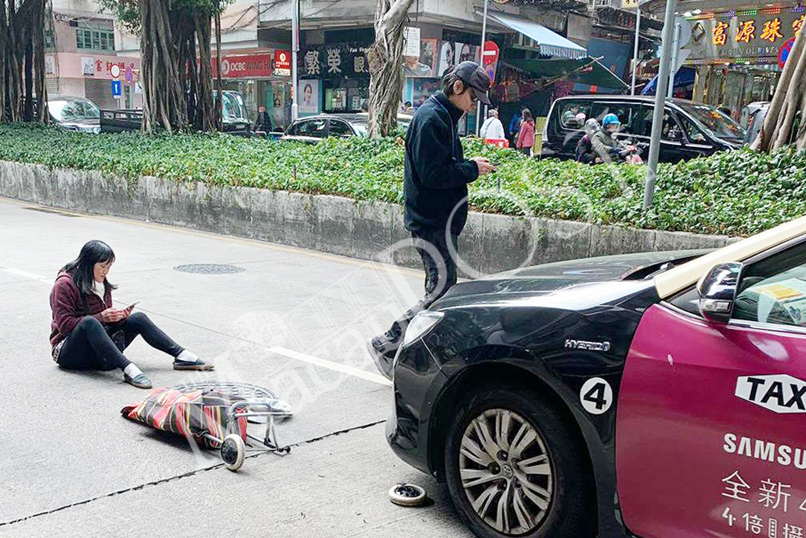 Woman on zebra crossing hit by taxi