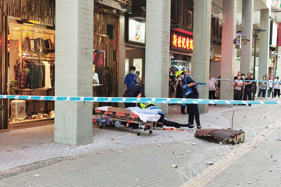 Falling canopy from high-rise seriously hurts pedestrian