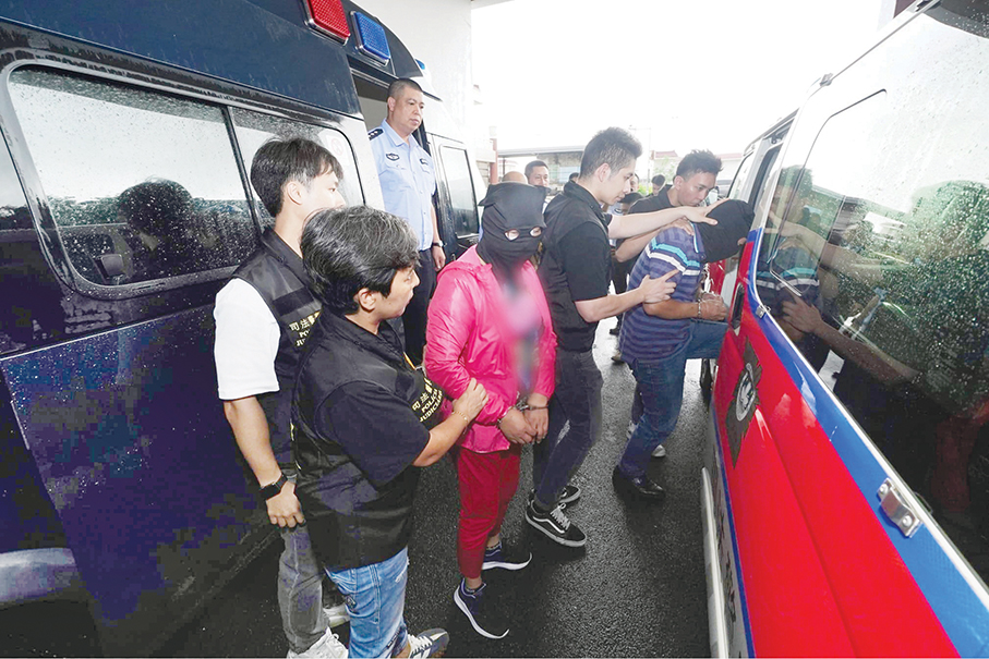 3 pyramid scheme fugitives returned by mainland: police