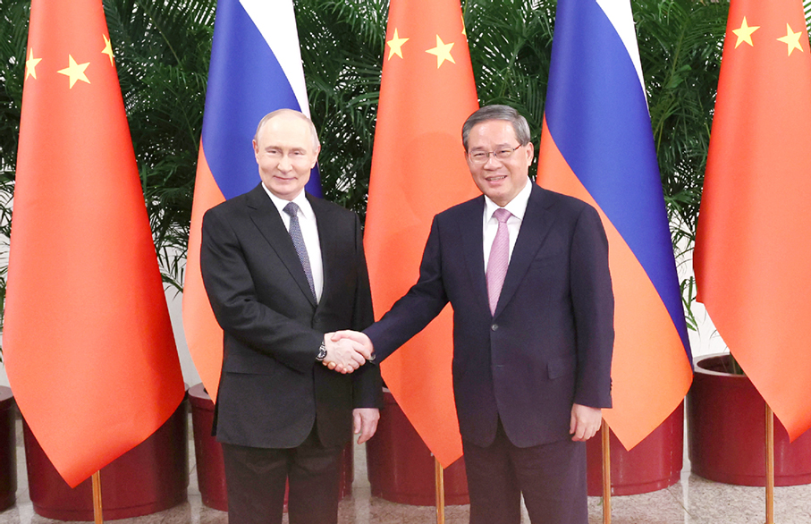 Li, Putin vow to increase cooperation, exchanges 